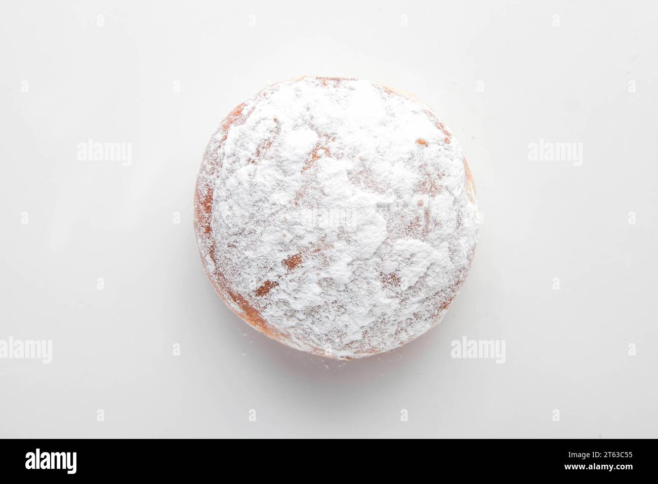 Strawberry filled jam brioche doughnut. Stock Photo
