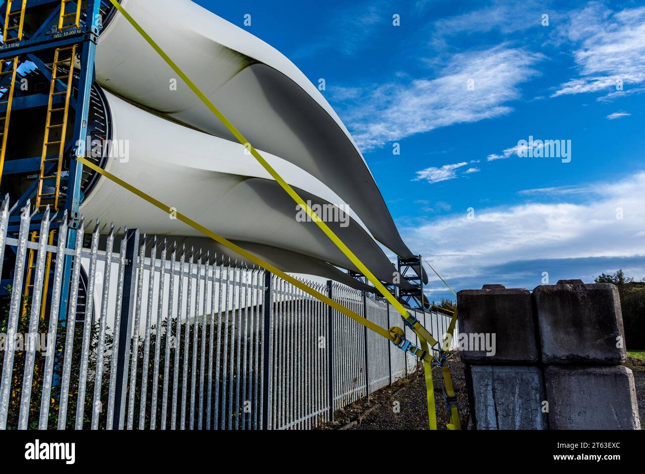 Off shore wind farm turbine blades stacked at Killybegs harbour, County Donegal, Ireland Stock Photo