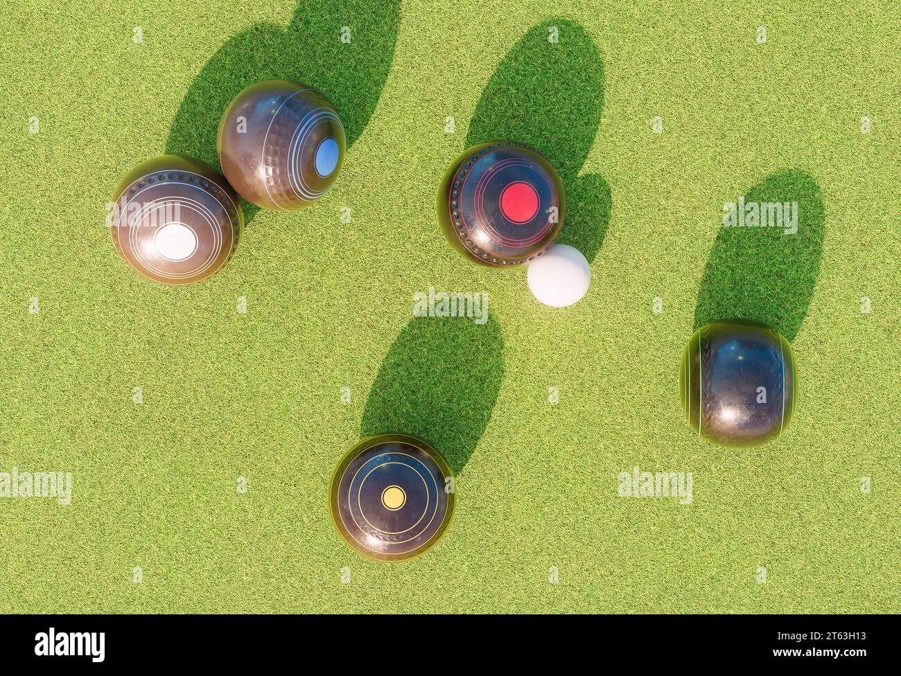 A set of old wooden lawn bowls next to a jack on a perfect flat green grass lawn outdoors - 3D render Stock Photo