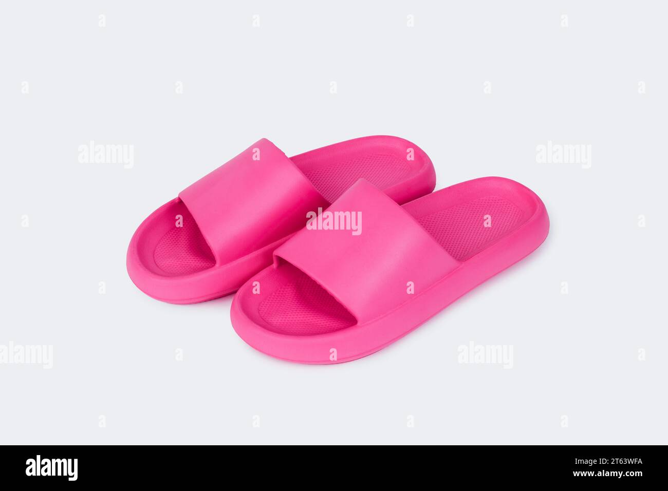 a pair of pink sandals on a white background Stock Photo