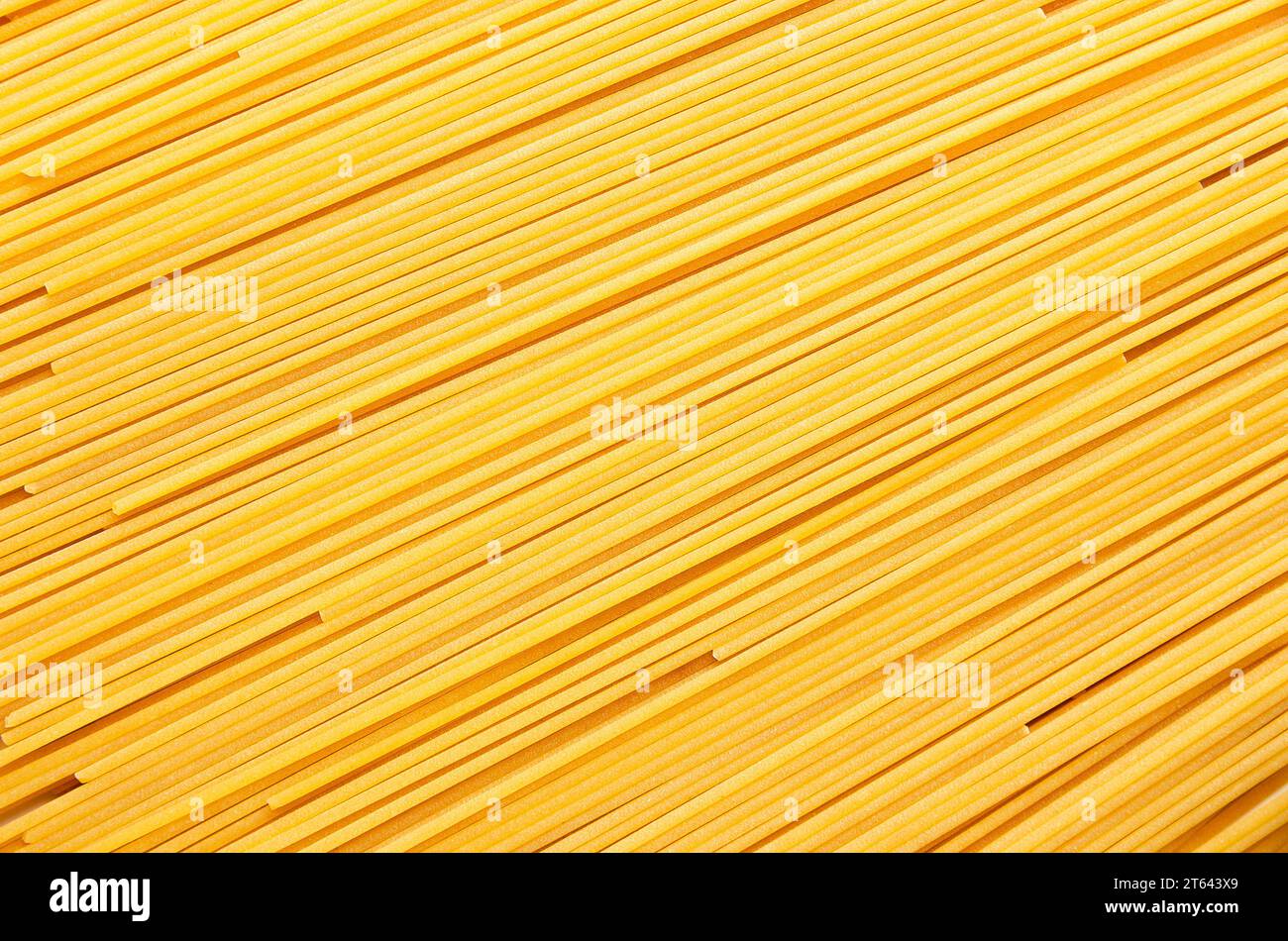Background of spaghetti forming diagonal lines. Stock Photo