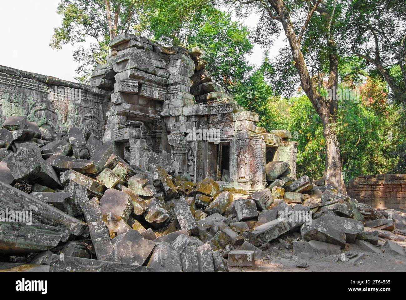 Covered with moss and lichen stones near the temple of Banteay Kdei. Angkor Thom. Cambodia Stock Photo