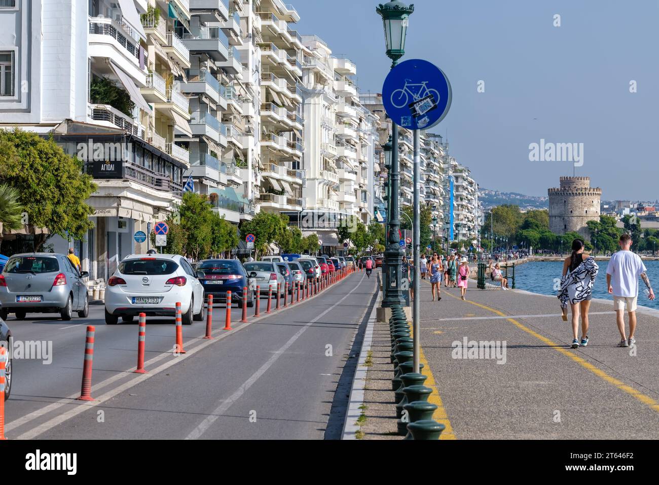 Thessaloniki, Greece - September 22, 2023 : View of the famous Paralia, the popular  beach promenade and the famous White Tower Stock Photo