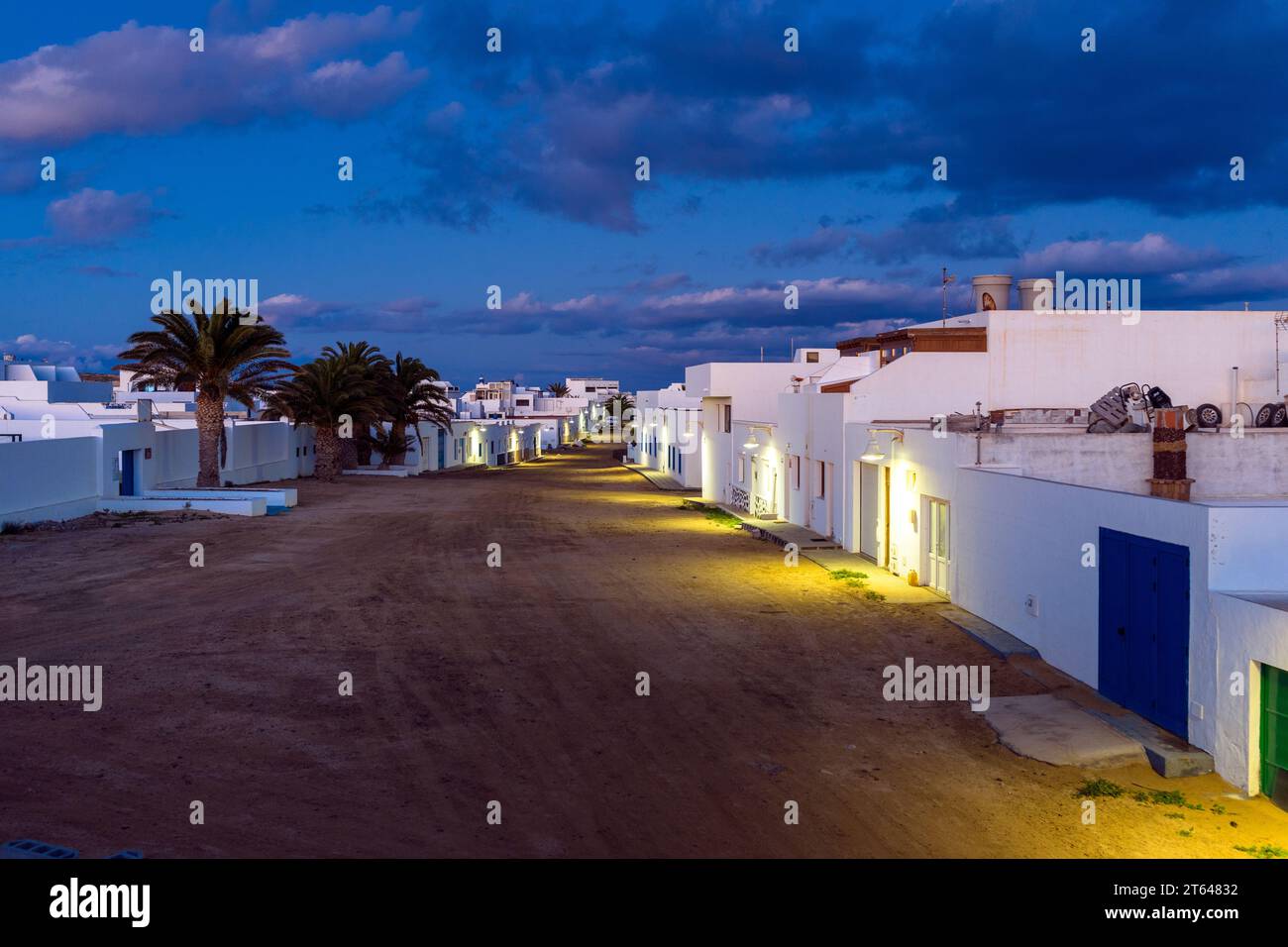 Spain, Canary Islands, la Graciosa: sandy streets between the white houses of the island of La Graciosa on sunset Stock Photo