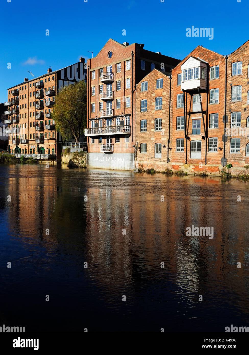 Former warehouses along the River Aire at Calls Landing in Leeds West Yorkshire England Stock Photo