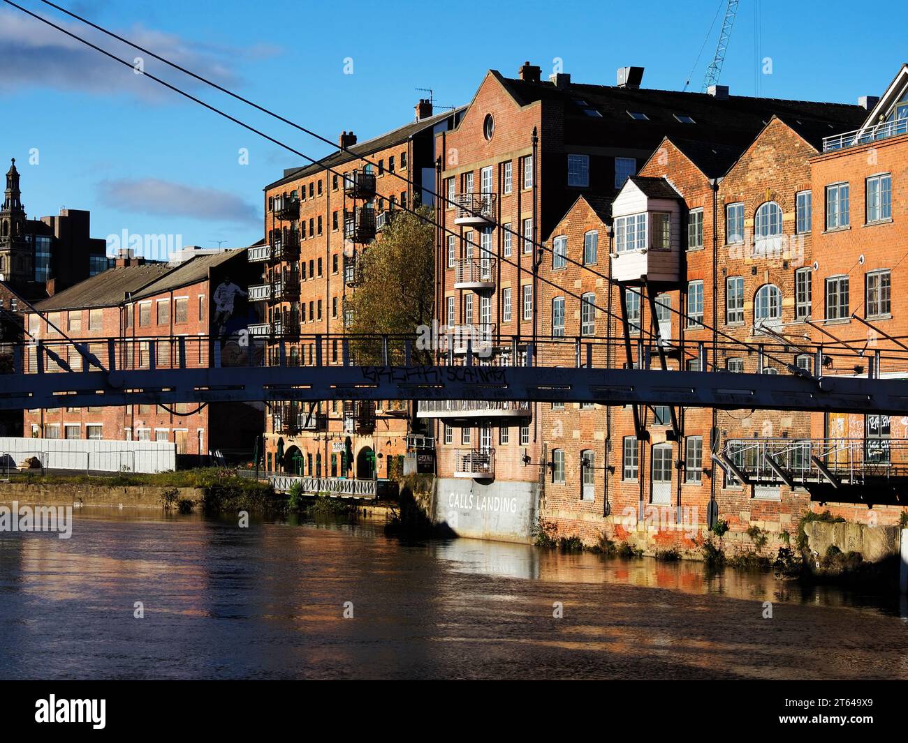 Former warehouses along the River Aire at Calls Landing in Leeds West Yorkshire England Stock Photo