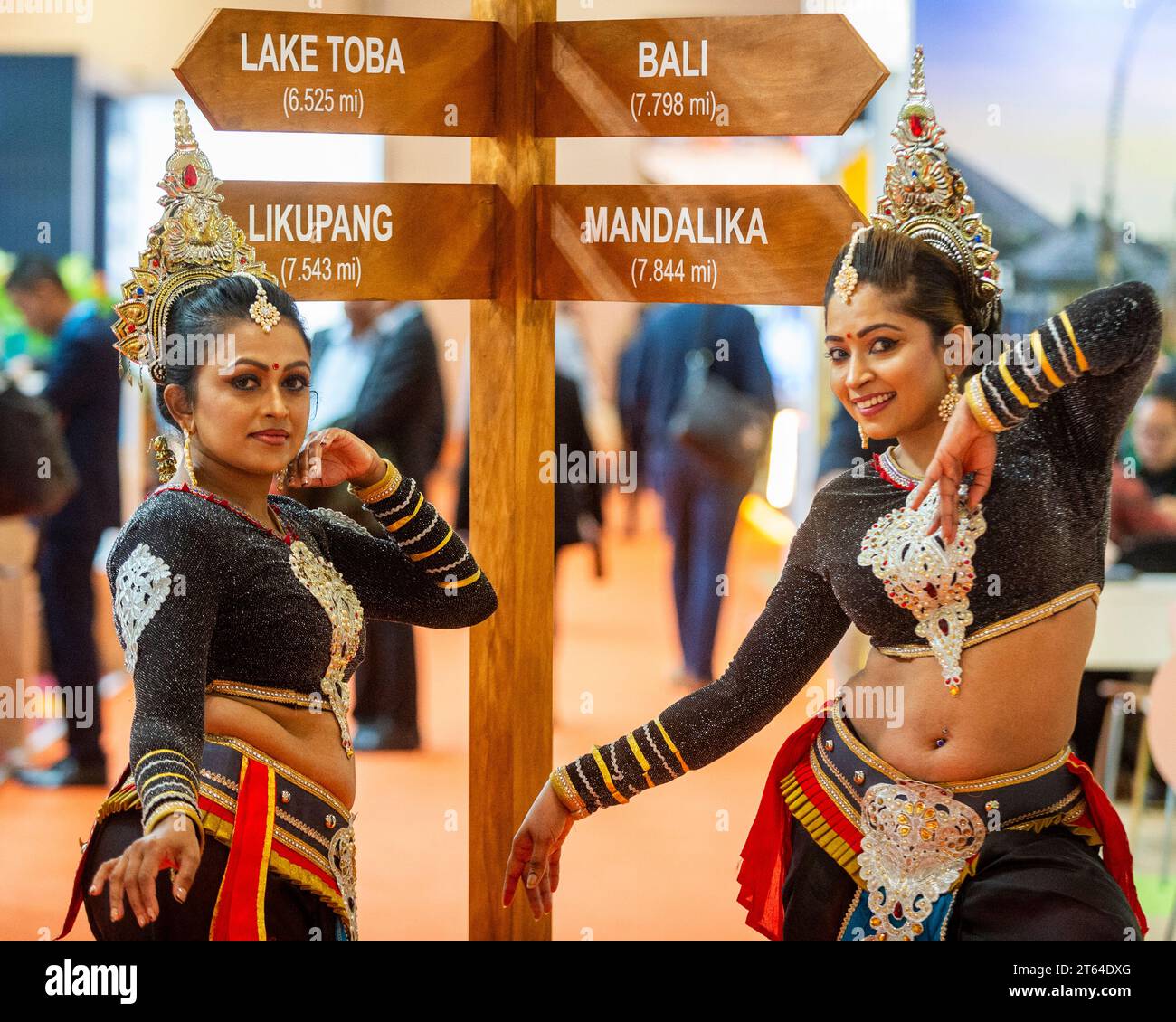 London, UK.  8 November 2023. Sri Lankan dancers with travel signage at World Travel Market London at the Excel centre.  In the King’s Speech the previous day, the government announced a consumers’ bill which, if introduced, would ban ‘drip pricing’, the practice where businesses advertise only part of a product’s price upfront and reveal other charges later in the buying process.  The airline industry is such an example, where the charging extra for luggage, seat selection, travel insurance or food and drink vouchers is common. Credit: Stephen Chung / Alamy Live News Stock Photo
