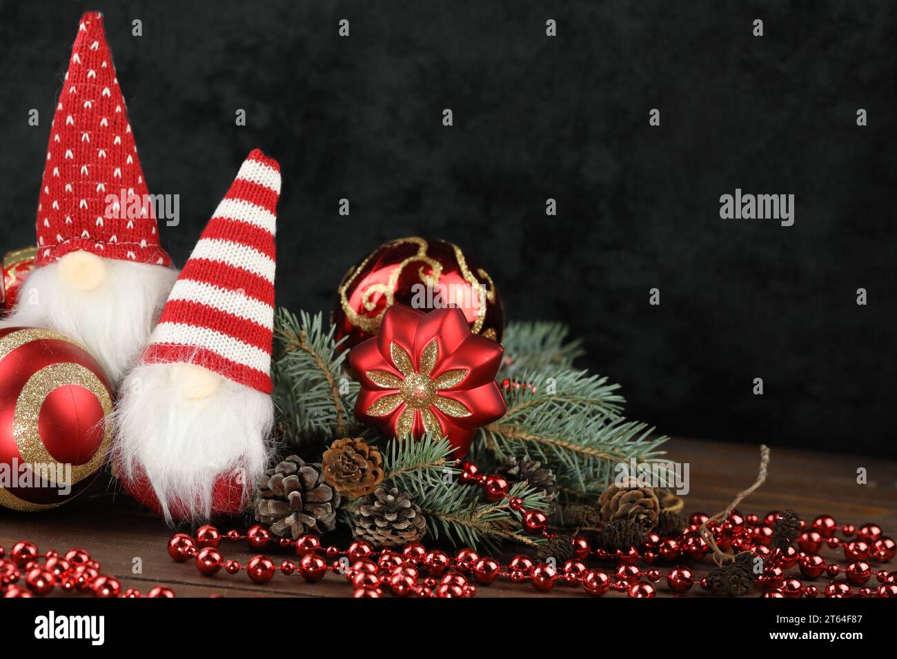 Black background with christmas decorations, dolls and copy space Stock Photo