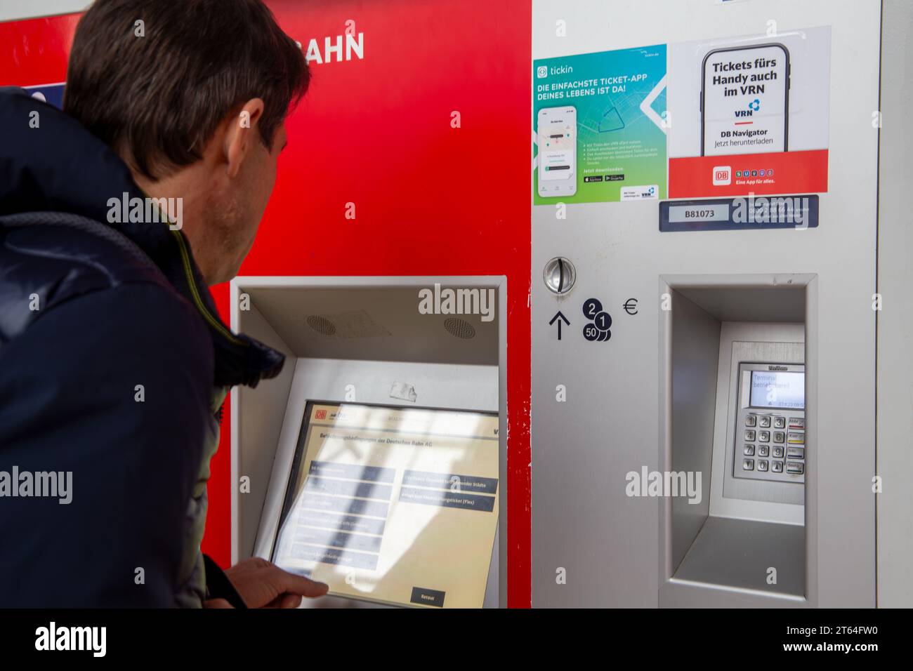 Man at a ticket counter at Heidelberg main station (model released Stock Photo Alamy
