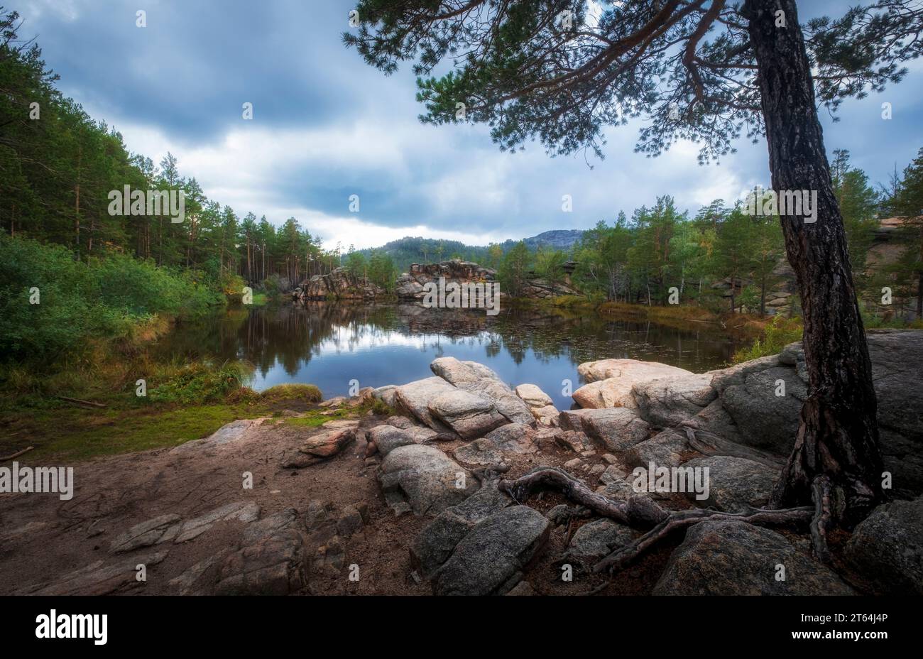 lake among rocks and forest on a sunny autumn day. The famous Devil Lake in Karkaralinsk national park in Kazakhstan Stock Photo