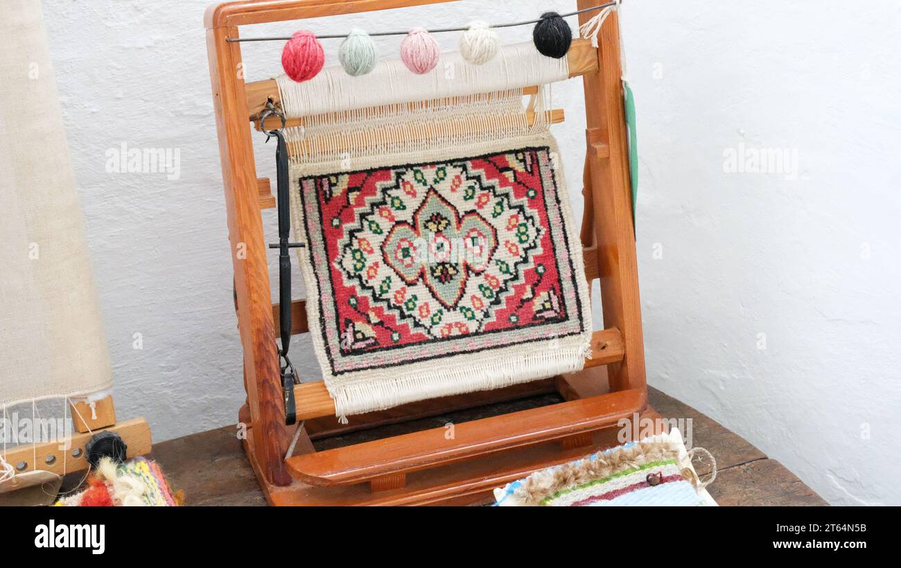 Small model loom demonstrating how a tapestry is made -John Gollop Stock Photo