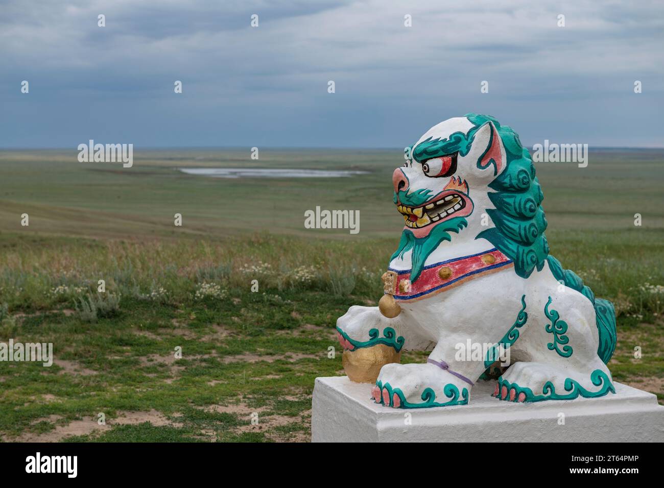 ELISTA, RUSSIA - JUNE 04, 2023: Sculpture of a lion guard against the background of the Kalmyk steppe on a cloudy June evening Stock Photo