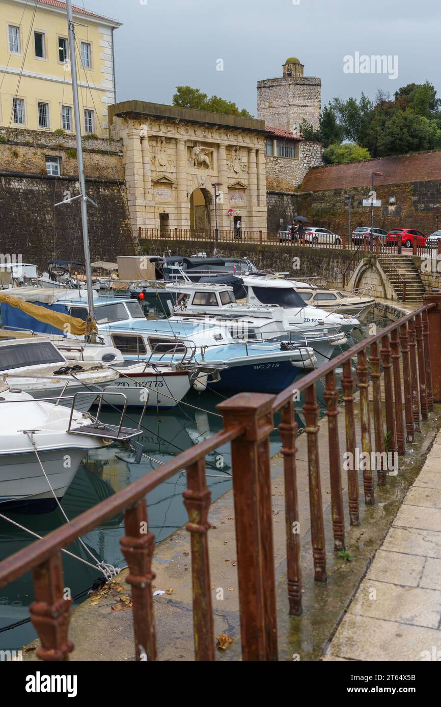 Old town city gate (land gate) and harbor with boats in Zadar, Croatia ...