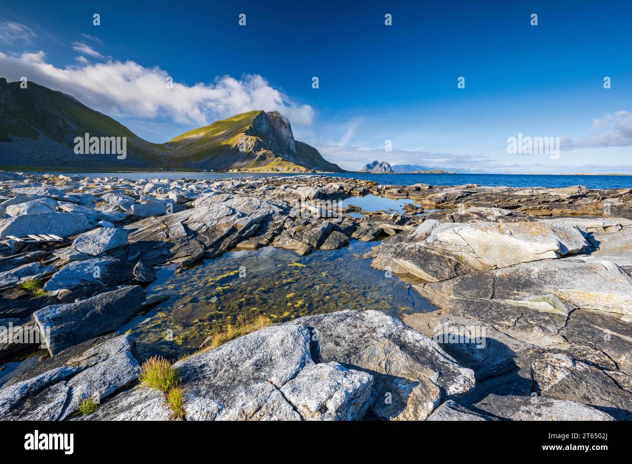 Rocky coast and mountains of the island of Vaeroy, Vaeroy, Lofoten, Norway Stock Photo