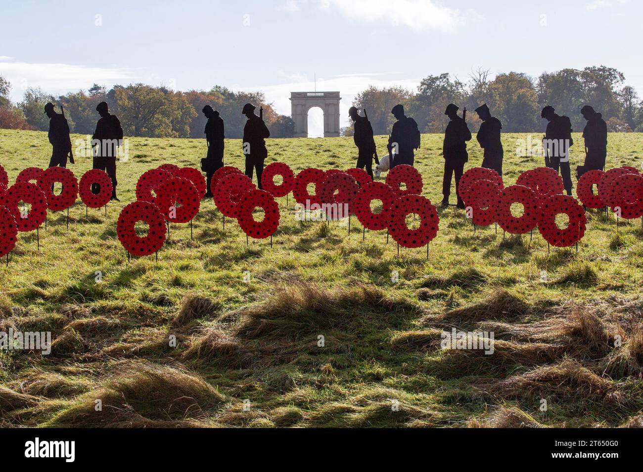 soldier silhouettes and poppies handmade by volunteers from recycled materials as part of the STANDING WITH GIANTS Remembrance Day art installation at Stock Photo