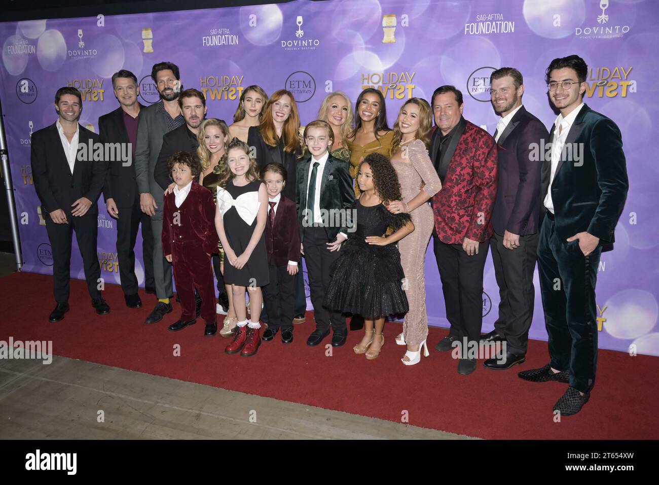 November 7, 2023, Hollywood, California, United States: (L-R) Jeff Rector, Caylee Cowan, Sadie Stratton, Stephanie Garvin, Kelly Stables, Melody Thorton, Brian Thomas Smith and Haley Reinhard attend the World Premiere of â€œHoliday Twistâ (Credit Image: © Billy Bennight/ZUMA Press Wire) EDITORIAL USAGE ONLY! Not for Commercial USAGE! Stock Photo
