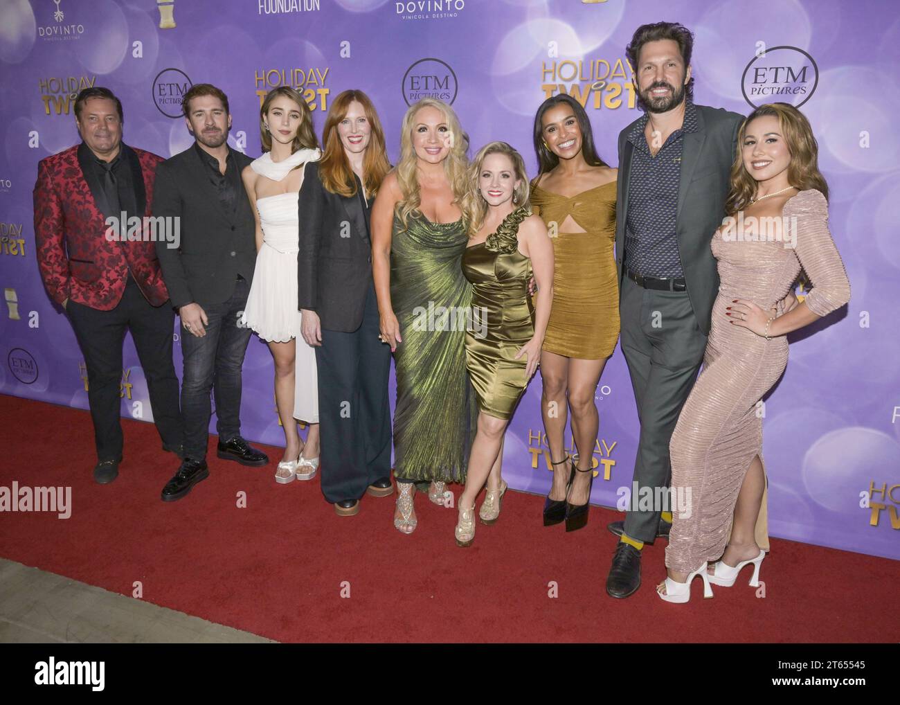 November 7, 2023, Hollywood, California, United States: (L-R) Jeff Rector, guest, Caylee Cowan, Sadie Stratton, Stephanie Garvin, Kelly Stables, Melody Thorton, Brian Thomas Smith and Haley Reinhar attend the World Premiere of â€œHoliday Twistâ (Credit Image: © Billy Bennight/ZUMA Press Wire) EDITORIAL USAGE ONLY! Not for Commercial USAGE! Stock Photo