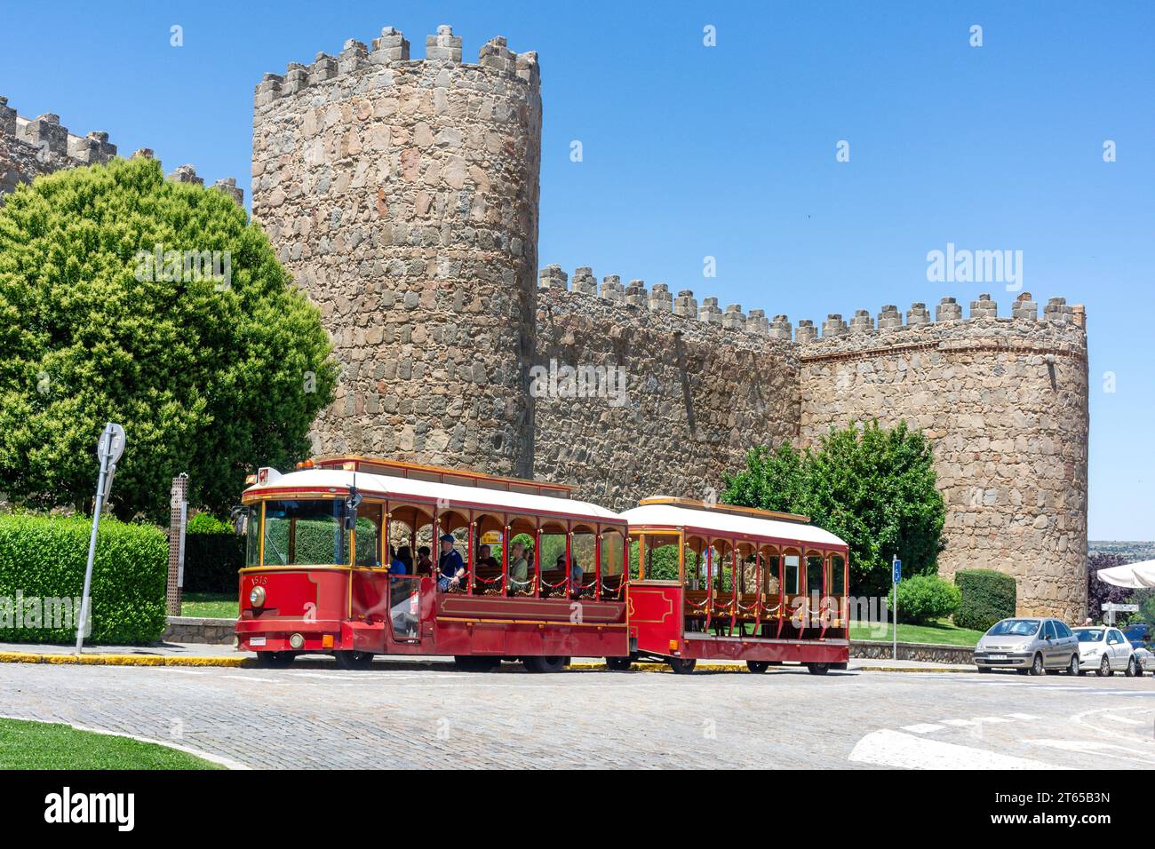Ávila Tram by city walls (Muralla de Ávila), Calle Ronda Vieja, Ávila, Castile and León, Kingdom of Spain Stock Photo
