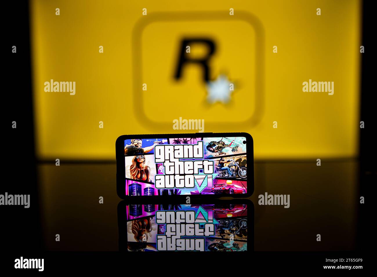GTA VI logo and Rockstar games company logo in background on screen. Rockstar games announces to release GTA SIX video game Stock Photo