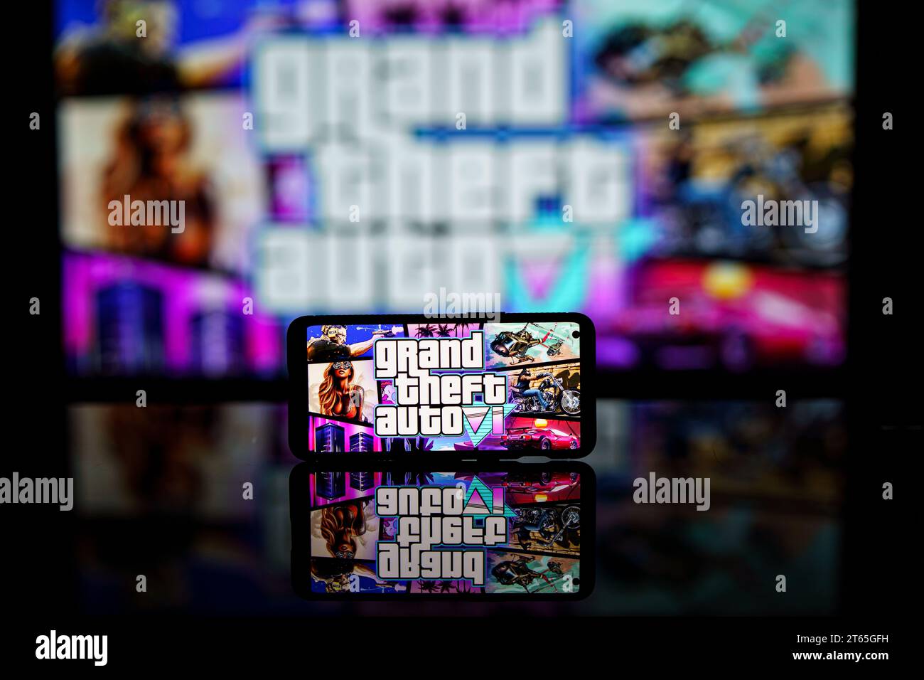 GTA VI logo and Rockstar games company logo in background on screen. Rockstar games announces to release GTA SIX video game Stock Photo