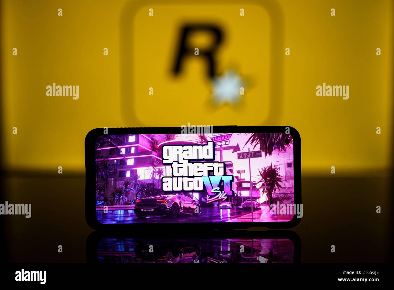 GTA VI logo and Rockstar games company logo in background on screen. Rockstar games announces to release GTA SIX video game Stock Photo