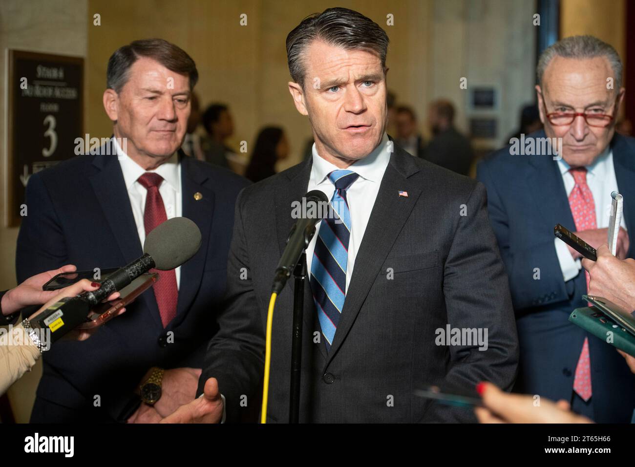 United States Senator Todd Young (Republican of Indiana), center, is joined by United States Senator Mike Rounds (Republican of South Dakota), left, and United States Senate Majority Leader Chuck Schumer (Democrat of New York), right, for a press briefing in between panels of the Senate bipartisan AI Insight Forums in the Russell Senate Office Building in Washington, DC, Wednesday, November 8, 2023. The AI Insight Forums seek to bring together AI stakeholders to supercharge the Congressional process to develop bipartisan artificial intelligence legislation. The Forums have focused on capitaliz Stock Photo