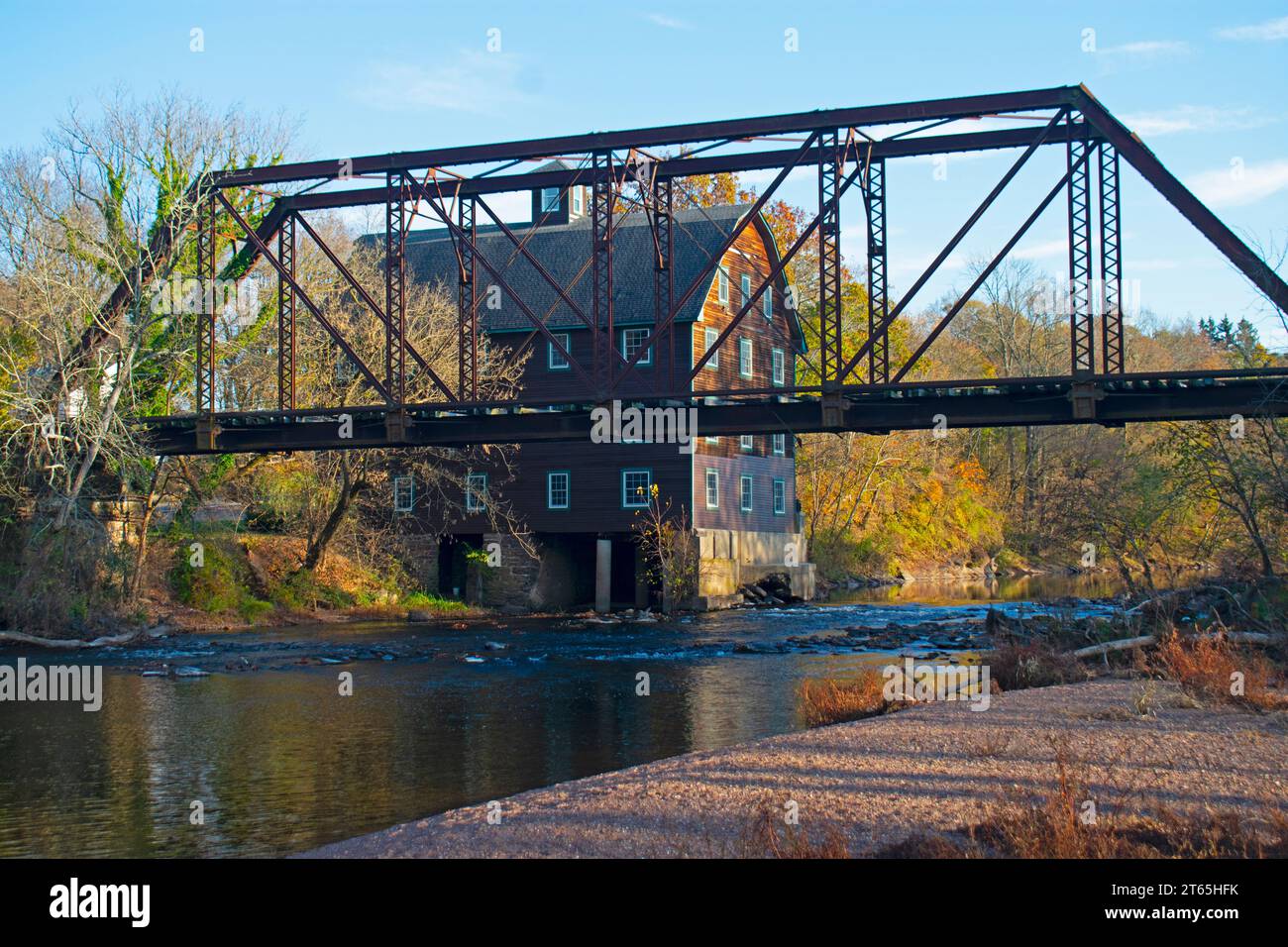 Historic Mill House Behind An Abandoned Railroad Trestle Spanning The ...