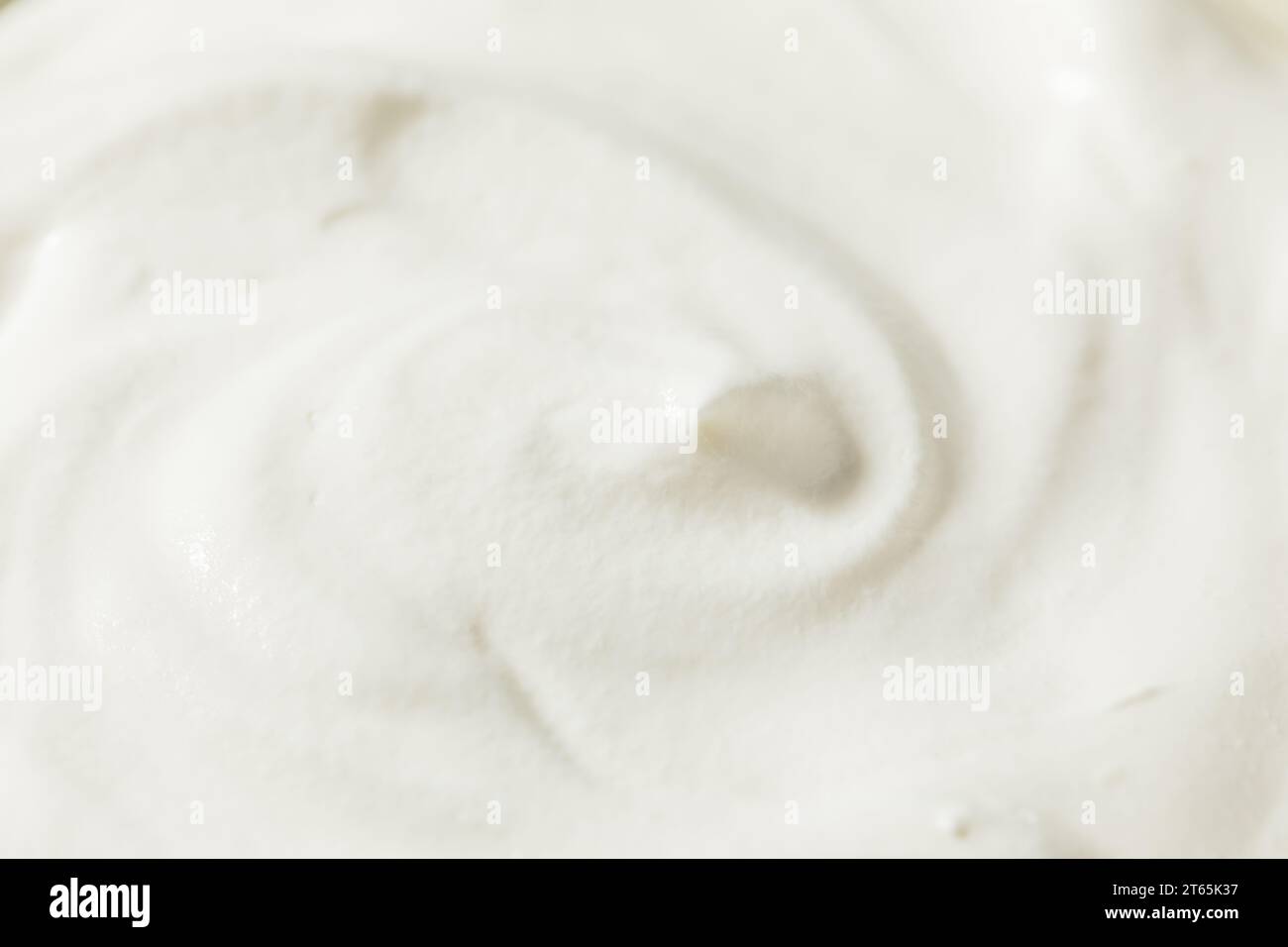 Sweet White Whipped Cream Dessert in a Bowl Stock Photo