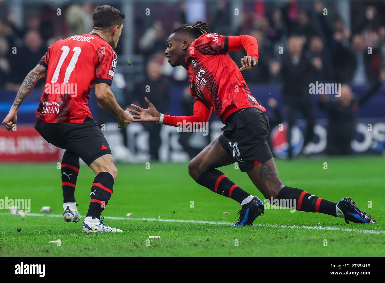 Rafael Leao of AC Milan (R) celebrates after scoring a goal with ...