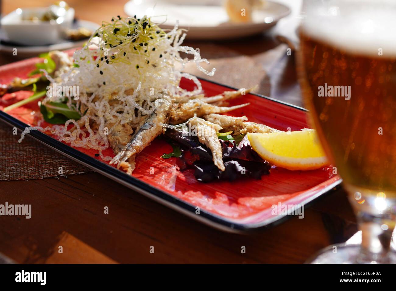 Boquerones fritos, typical Spanish tapas, Spanish fried anchovies Stock Photo Alamy
