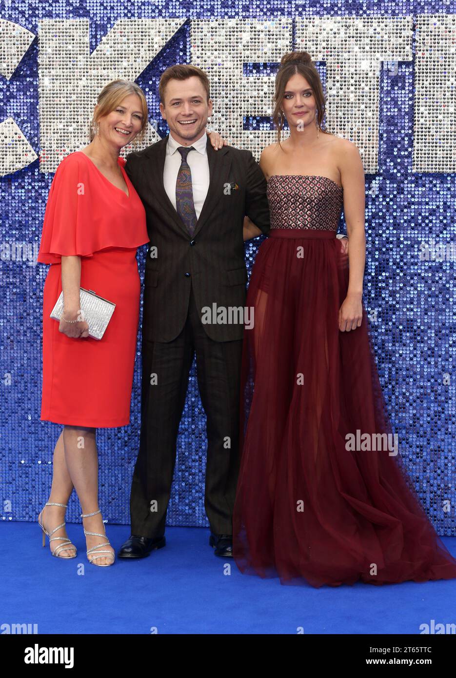 Taron Egerton with mother Christine Egerton (L) and partner Emily