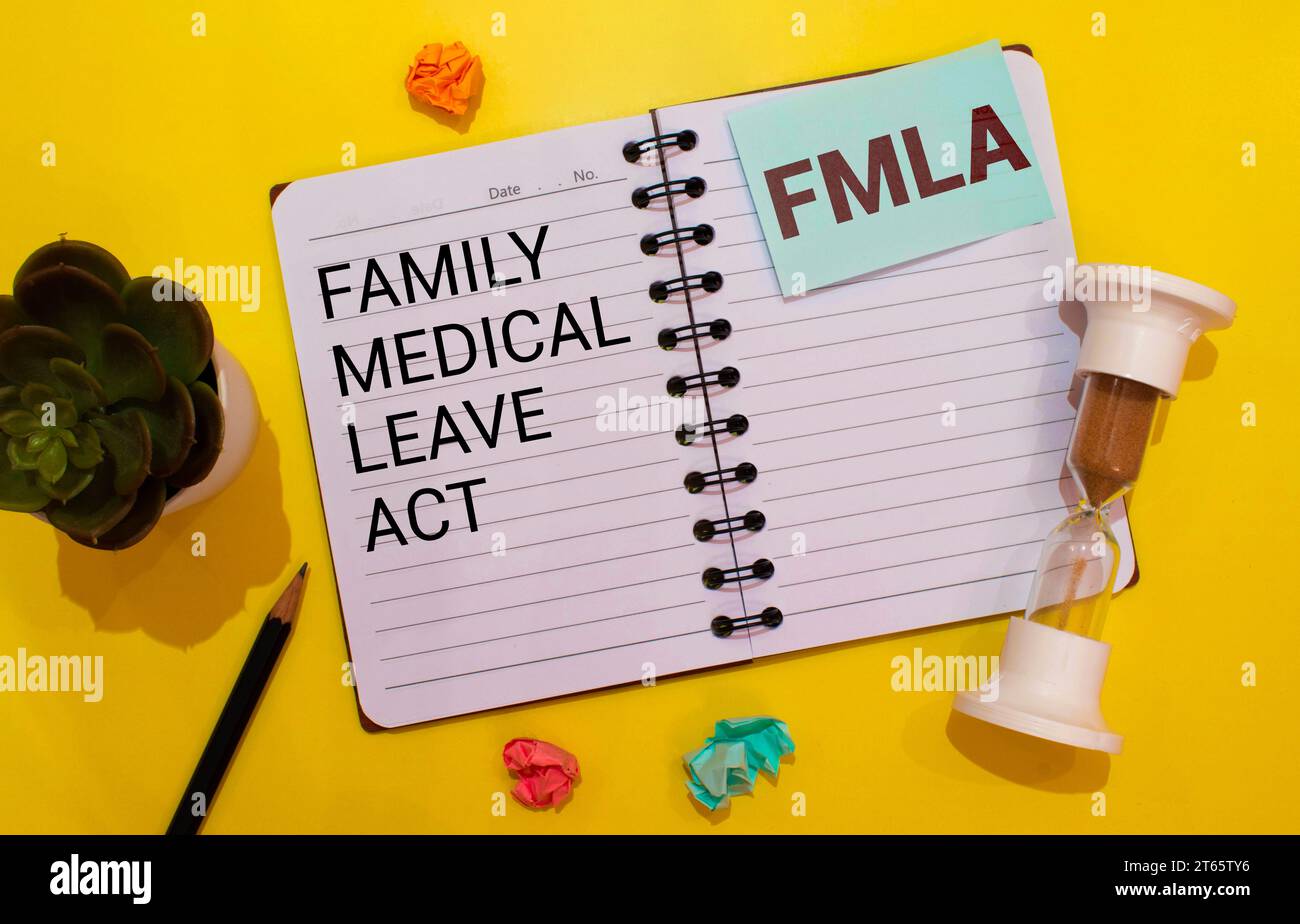 Family And Medical Leave Act FMLA written on notebook with stethoscope