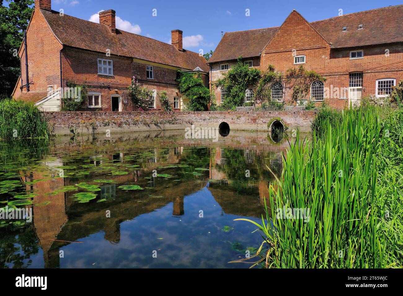 Flatford Mill with near perfect reflections in River Stour, Flatford  village, John Constable Country, Dedham Vale, Suffolk, England, UK Stock Photo
