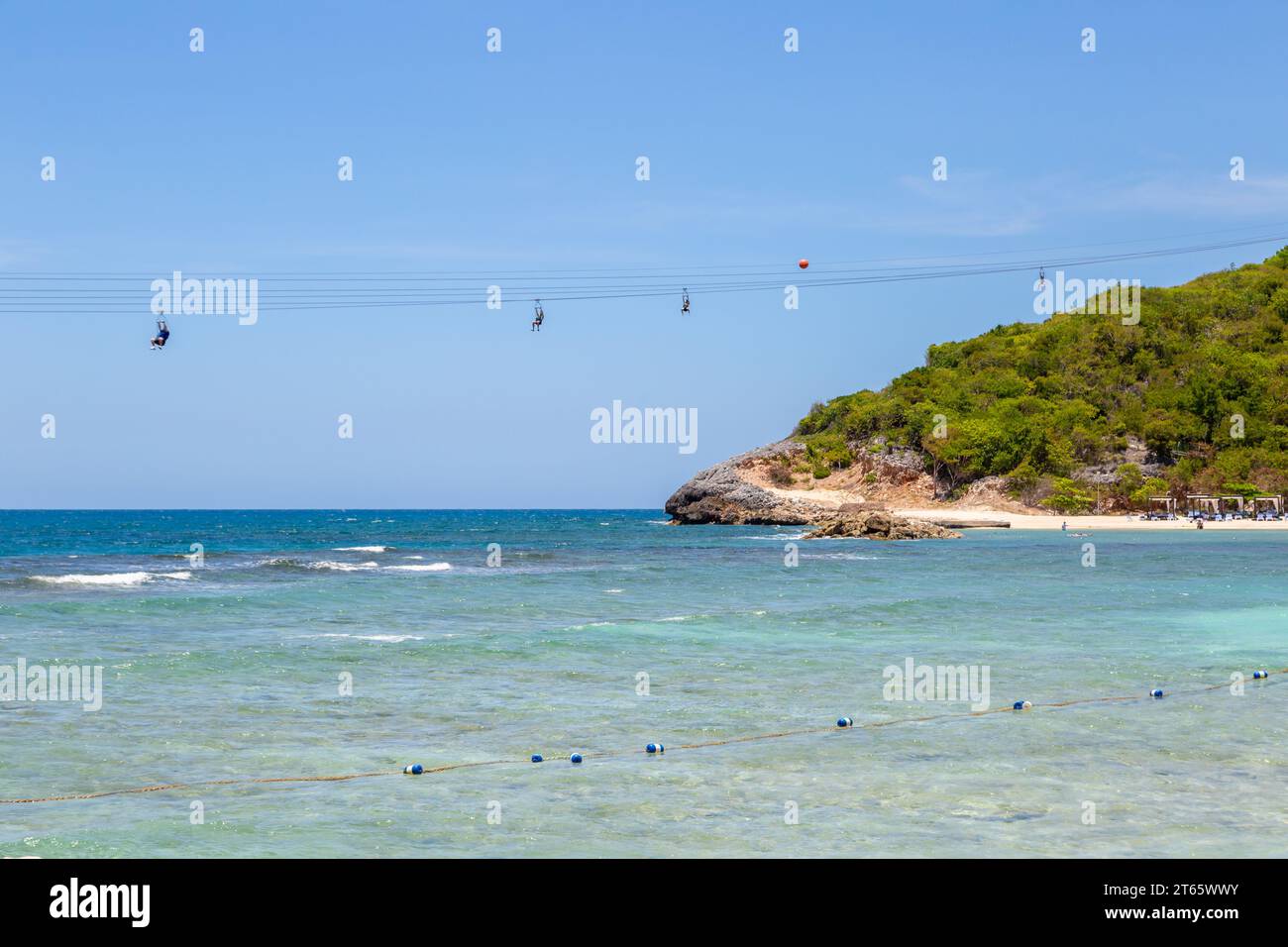 Cruise ship passengers riding the Dragon's Flight Zipline attraction on