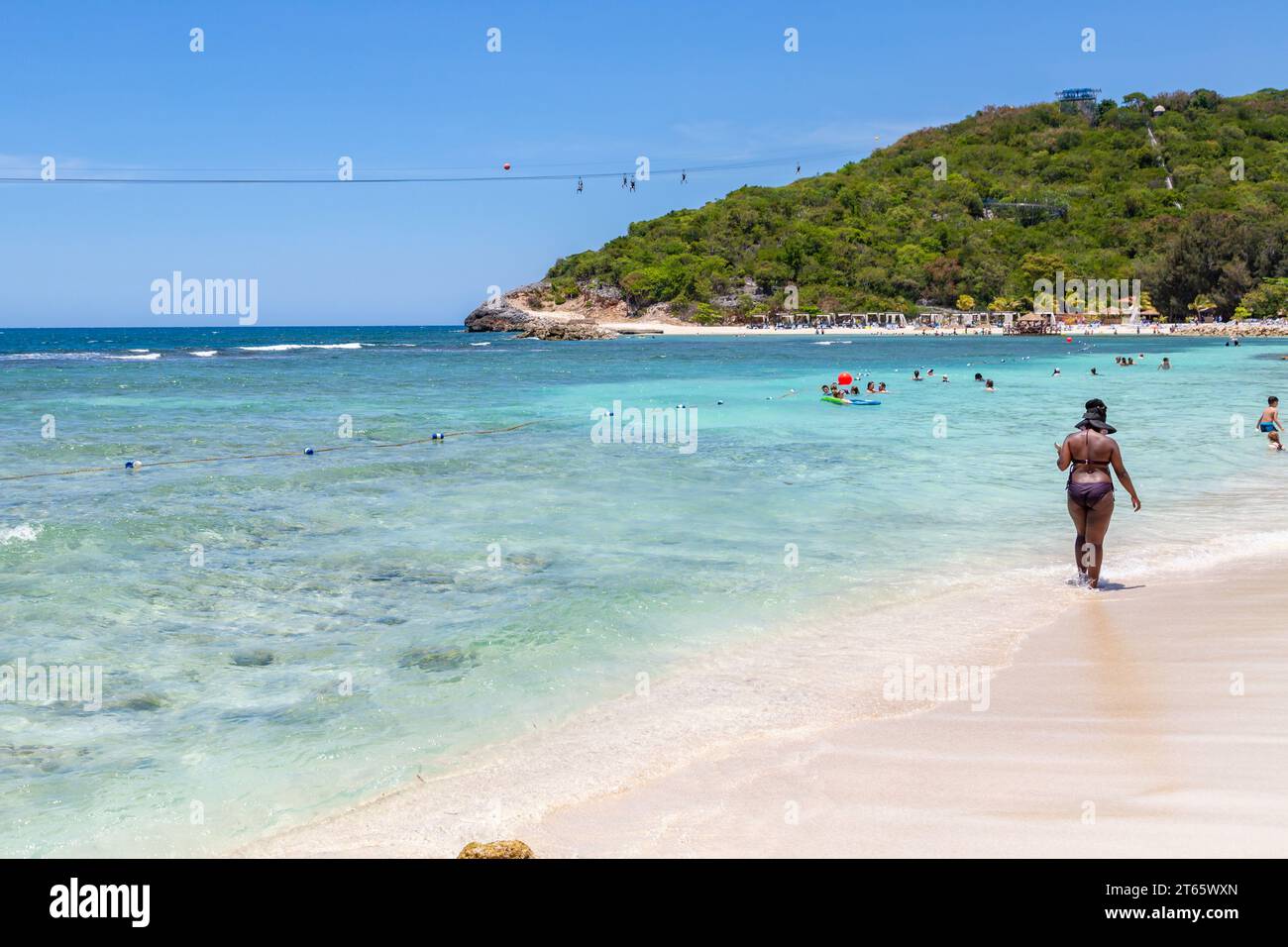 Cruise ship passengers riding the Dragon's Flight Zipline attraction on