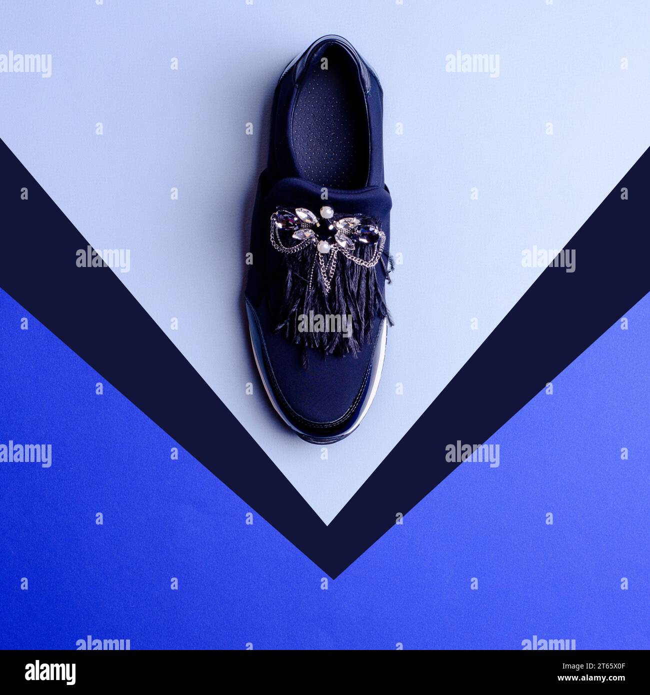 Bold dark blue female nonlacing shoe with an extravagant decorative