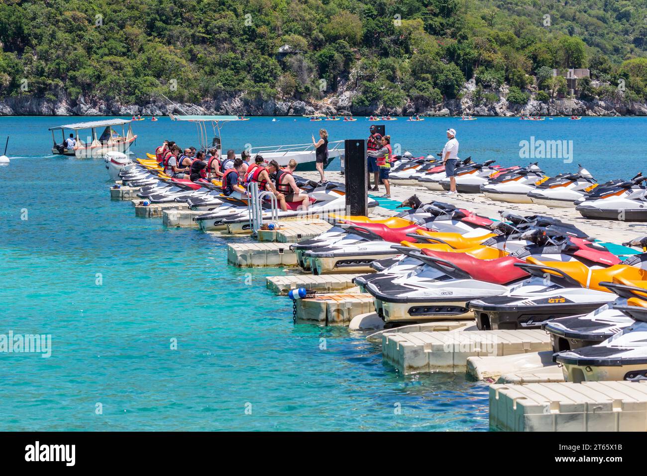 Cruise ship passengers listening to the rules for renting jet skis at
