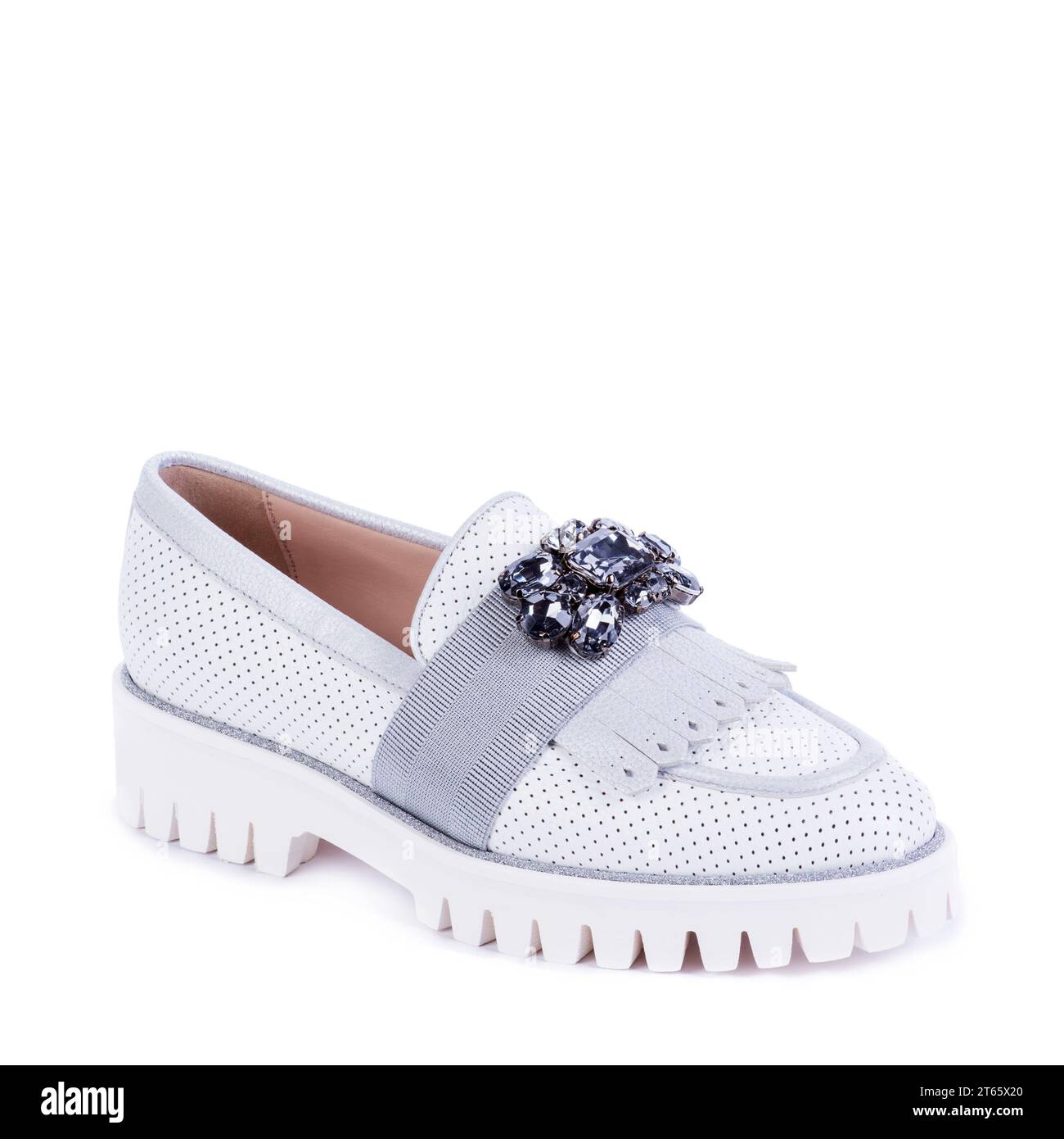 White perforated leather loafer whith ribbed sole on white background. Fashion blog. Seasonal footwear promotion. Retail, e-commerce store Stock Photo
