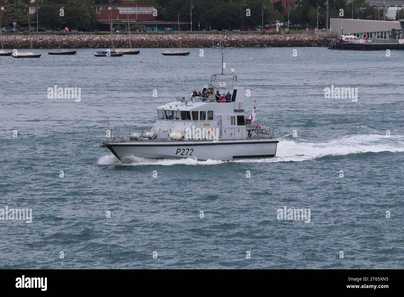 The Royal Navy P2000 type fast training boat HMS SMITER (P272) heads out of harbour Stock Photo