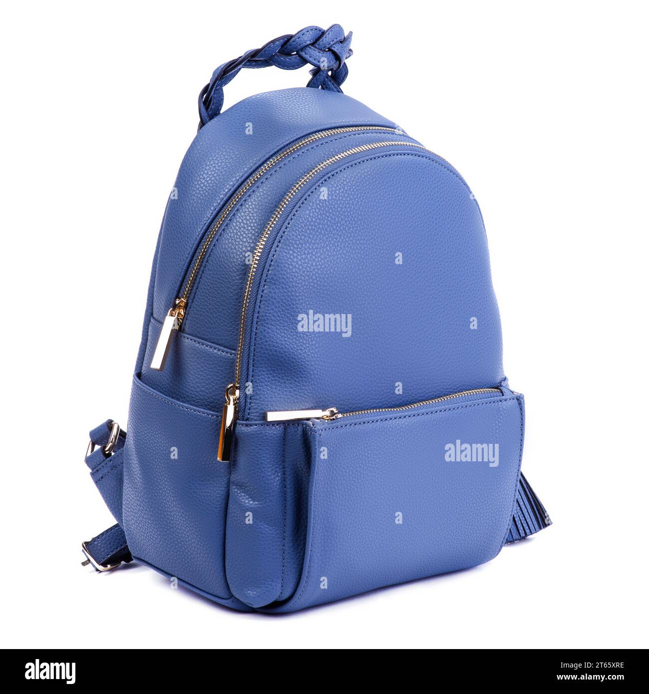 Close-up photo of trendy royal blue leather backpack with two zipped compartments and a pocket with an original braided handle isolated on a white bac Stock Photo