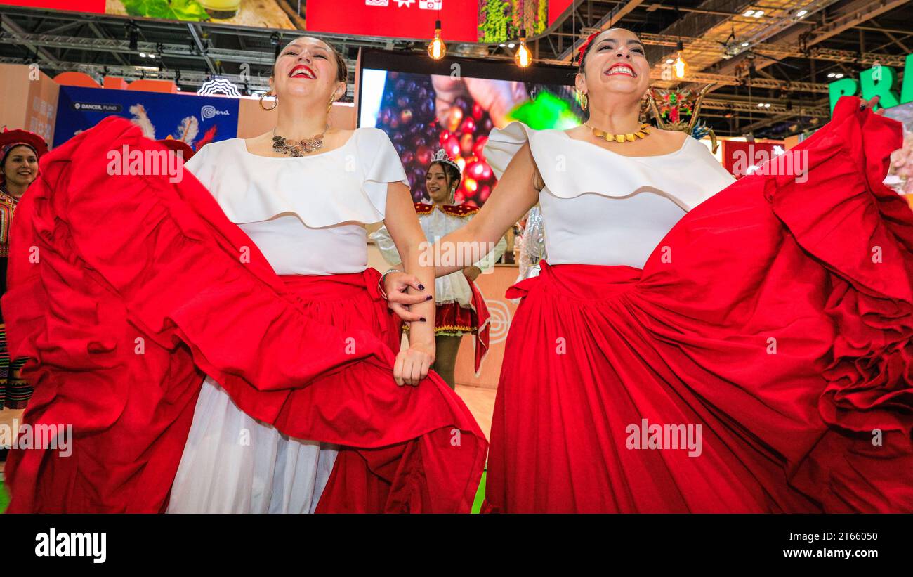 London, UK. 08th Nov, 2023. A final performance from the ArtPerUK dance group in regional costumes, as well as plenty of pisco sours served, mean the Peru booth is popular wih visitors as well as fellow exhibitors in the final hours. As every year, in the last couple of hours on the final day of World Travel Market at ExCel London many country booths and travel show stands hold informal gatherings and wrap parties to celebrate a successful three days of the trade show, often with performances, music, dancing and local food and drinks. Credit: Imageplotter/Alamy Live News Stock Photo