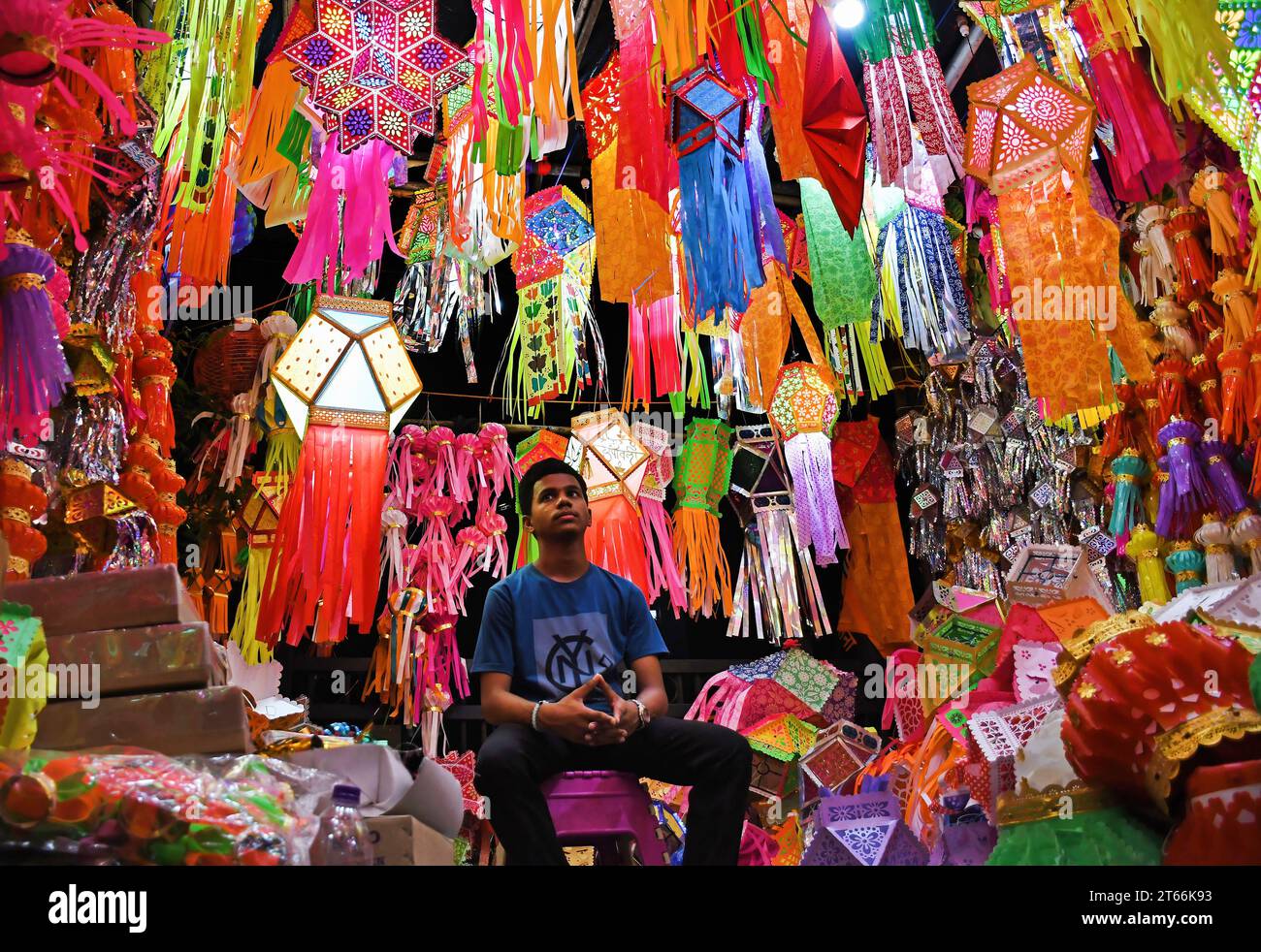 Mumbai, India. 08th Nov, 2023. A shopkeeper awaits customers to sell lanterns ahead of the Hindu festival of lights, Diwali in Mumbai. Diwali festival is celebrated by Hindus where they shop for lanterns ahead of the festival, clean their home, prepare sweets and snacks, make rangoli (traditional Indian art form where various designs are made on the floor) and light their homes with earthen lamps marking victory of light over darkness. Credit: SOPA Images Limited/Alamy Live News Stock Photo