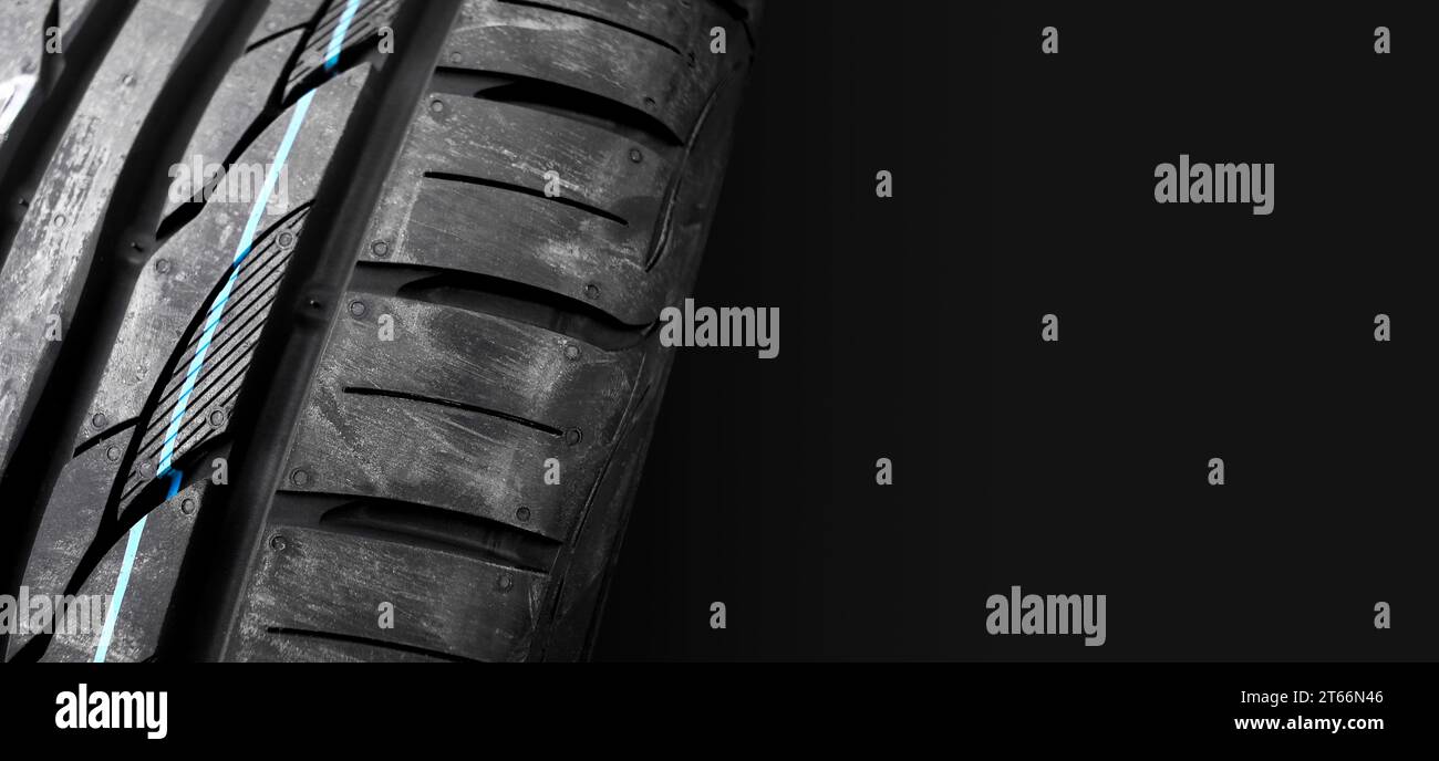 New car tires with colored lines on the tread , car tyre horizontal