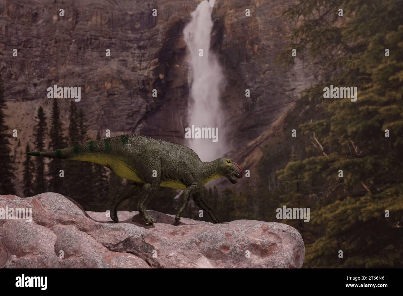 A Hadrosaurus (CollectA 2022) takes a peak over a cliff near a Late Cretaceous waterfall. Stock Photo