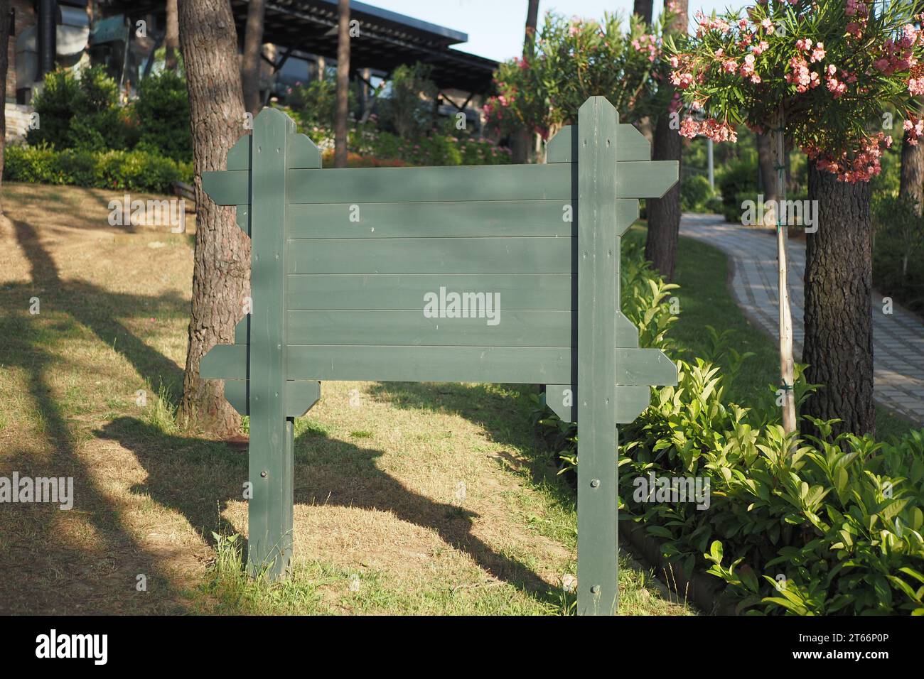 wooden sign in the a park with copy space concept Stock Photo - Alamy