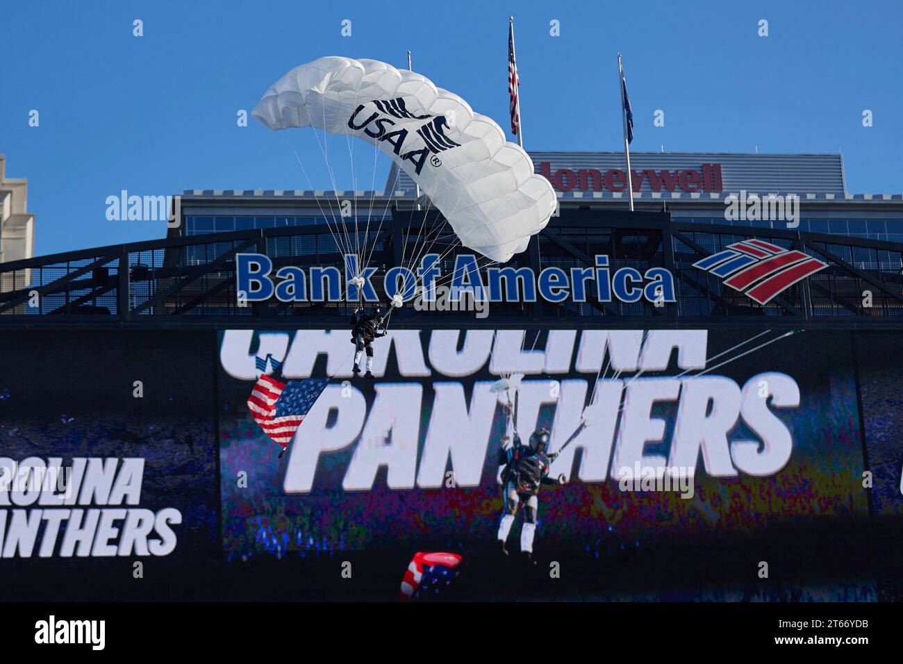 A parachutist flies into Bank of America Stadium prior to an NFL