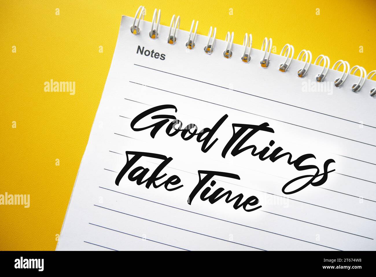 Good Things Take Time text on spiral notepad, concept for motivational slogan, Motivational Quote. Stock Photo