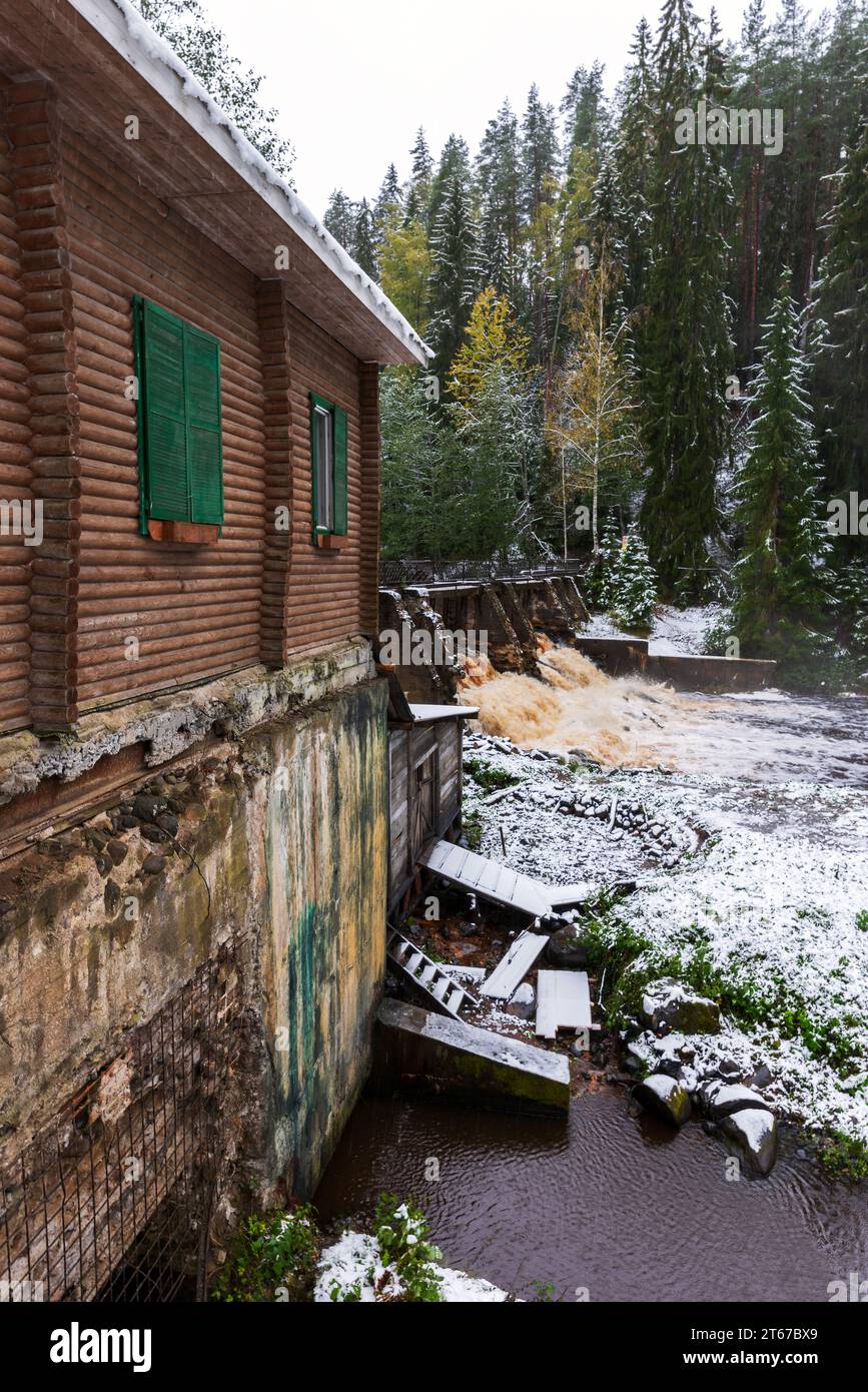 Vertical landscape photo with the abandoned Old Finnish hydroelectric plant at Volchya river. Known as Sosnovskaya Hydroelectric Power Station. Sosnov Stock Photo