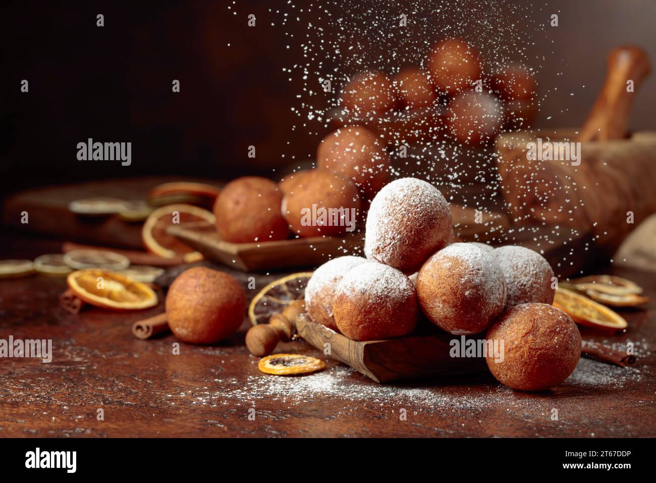 Balls of freshly baked homemade cottage cheese doughnuts sprinkled with sugar powder. Stock Photo