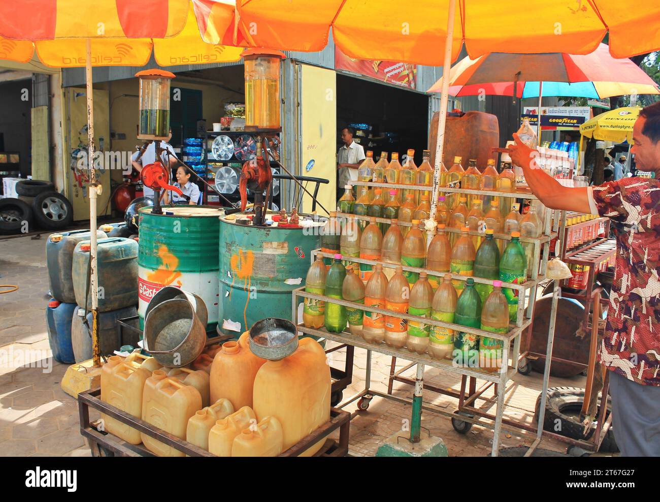Corner gas station in Battambang, Cambodia. One and twoliter soda